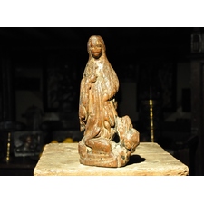 A MID 15TH CENTURY ENGLISH OAK SCULPTURE OF ST MARGARET EMERGING FROM THE DRAGON.