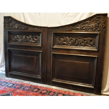 AN EXTREMELY RARE PAIR OF LATE 17TH CENTURY CARVED AND PIERCED OAK STAIR GATES. CIRCA 1680-1700.