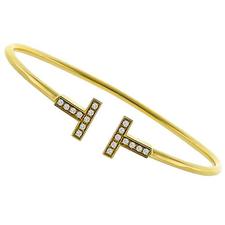 Estate Tiffany & Co 0.22ct Round Cut Diamond T 18k Yellow Gold Wire Bangle