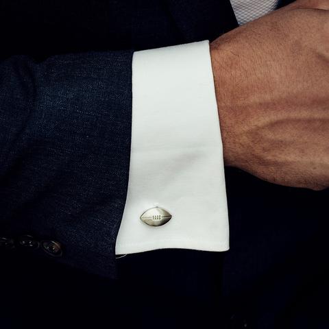 Rugby ball cufflinks person...