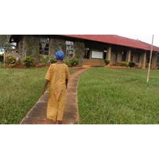 Former technician Esther Kika approaches the research station (Credit: Rachel Nuwer)